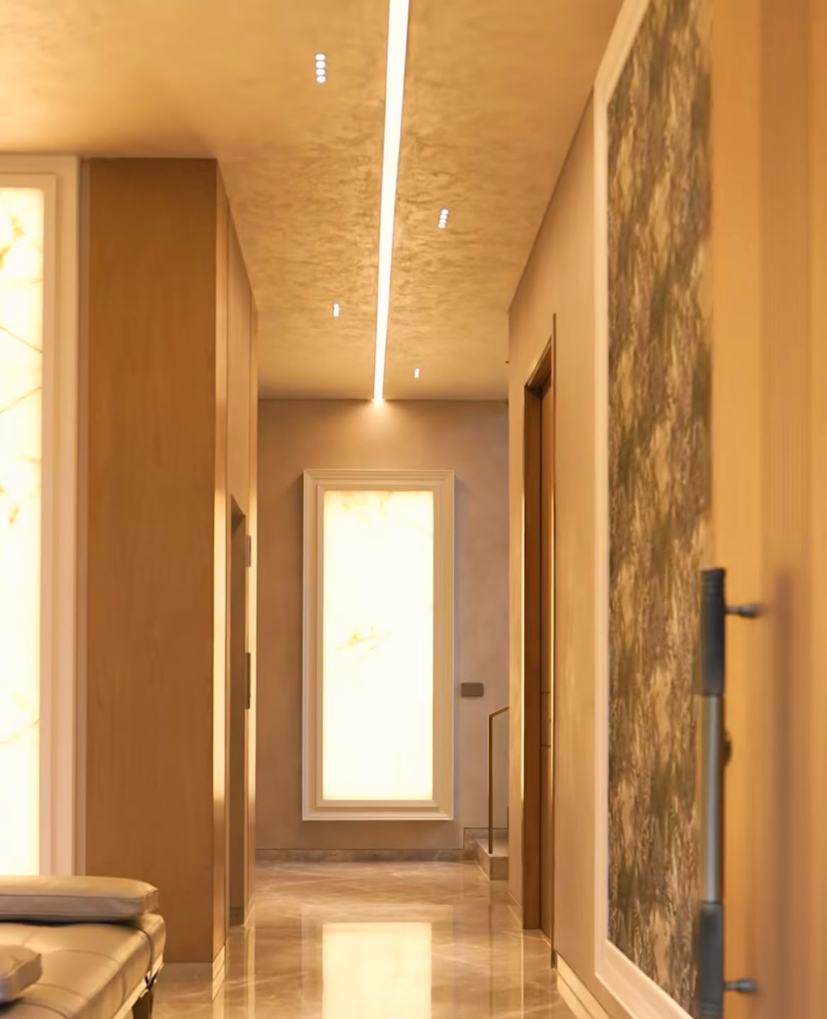 Corridor with backlit onyx panels and warm plaster ceiling